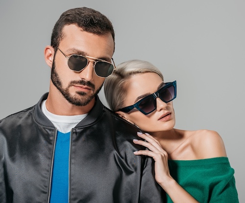 Man and woman wearing sunglasses.